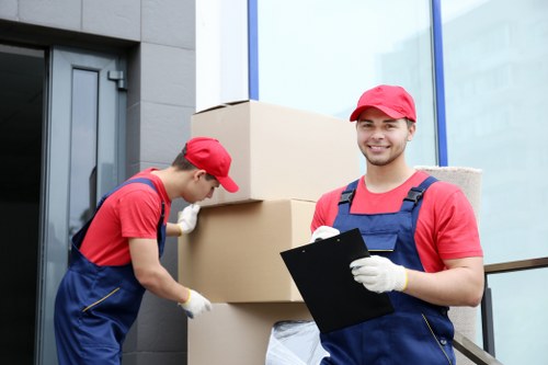 Furniture removal team handling apartment move in Docklands