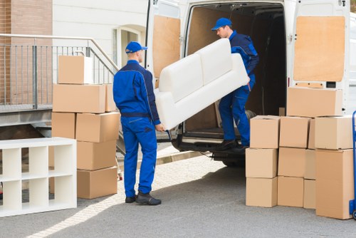 Student removal team preparing boxes in Docklands apartment building