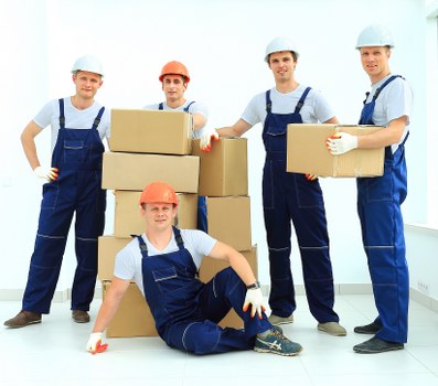 Professional movers loading office equipment in Docklands
