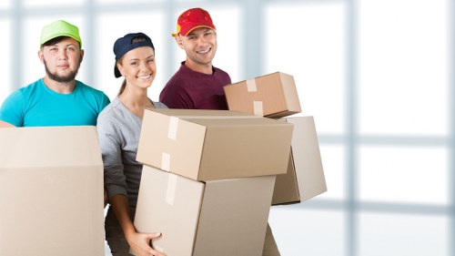 Boxes and furniture being unloaded at a Docklands property