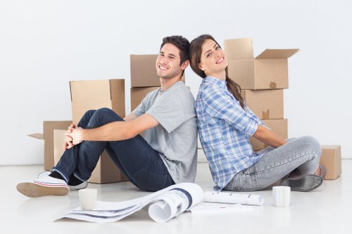 Professional movers handling desks and IT equipment during a Docklands relocation