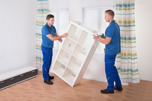 Local moving team loading furniture into a van in Docklands