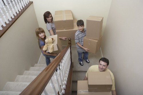 Student move with packed boxes ready for transport in Docklands